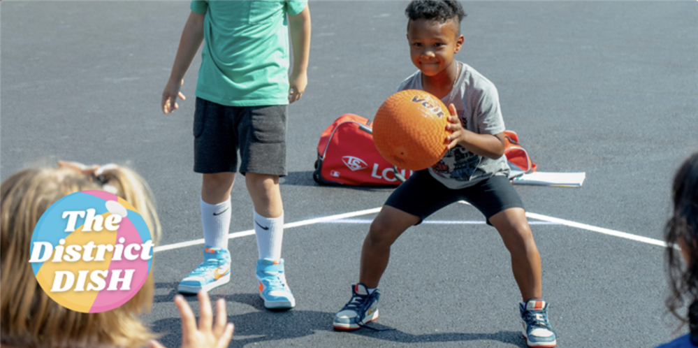  This is an image of a student playing four square. It serves as the header of the District Dish.